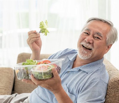 Dentures patient in Dallas eating healthy