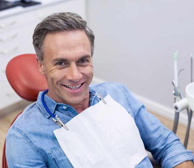 A woman revealing her bleeding gums