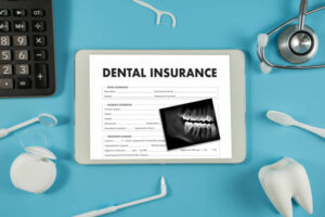 Dental insurance form and dental products on desk